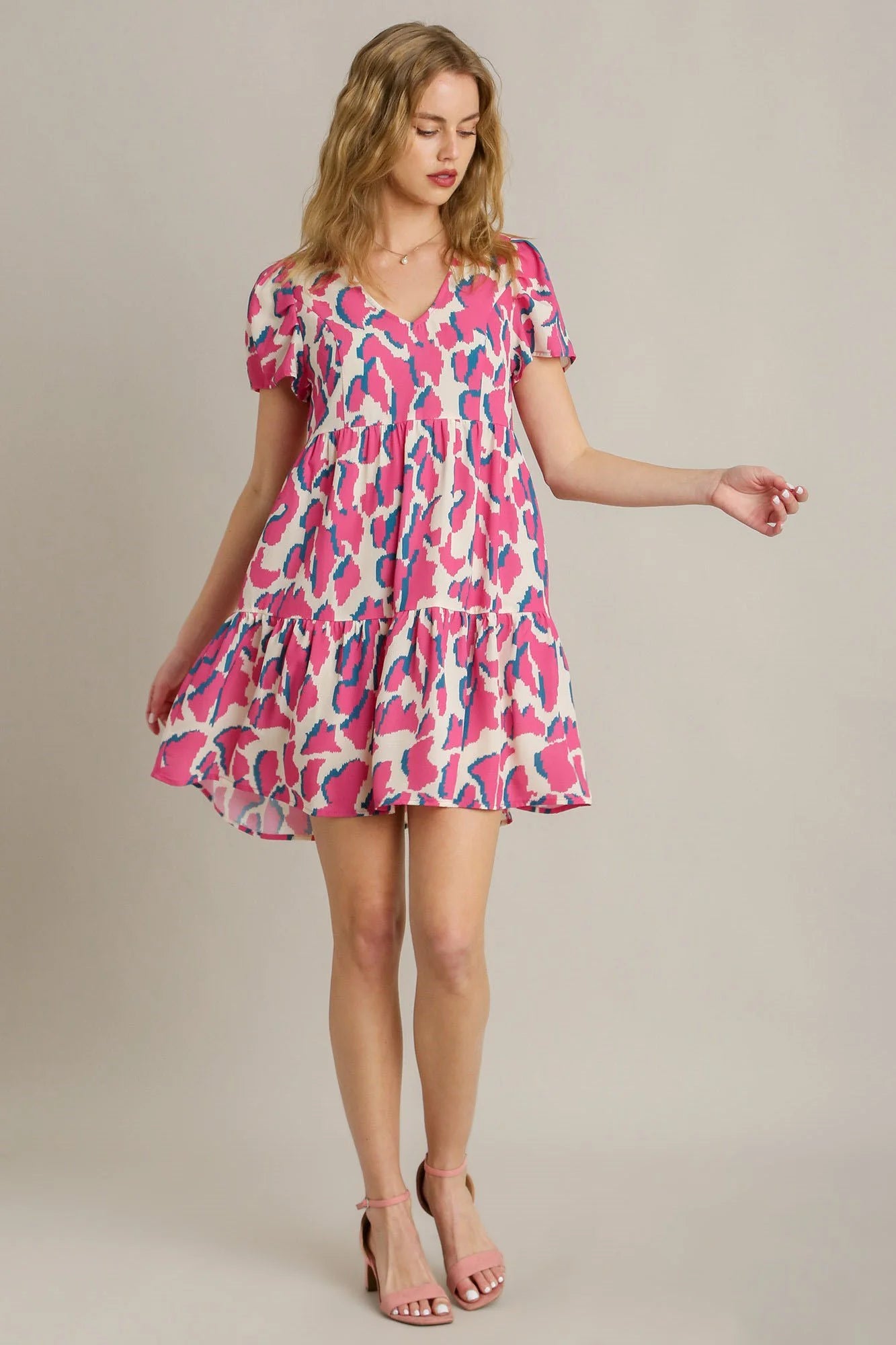 Umgee Full Size Abstract Print Pleat Detail Short Sleeve V-Neck Tiered Dress plus Size